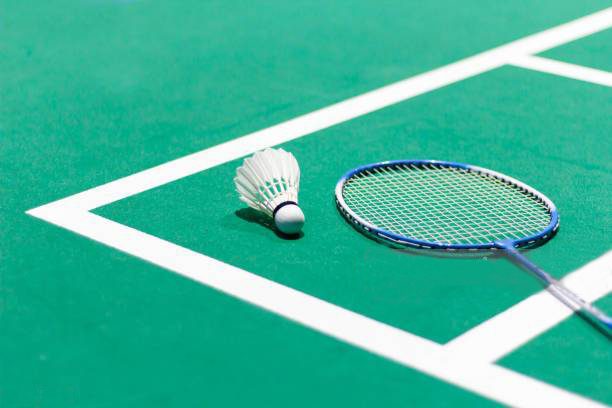 Badminton racket in floor of ground in badminton